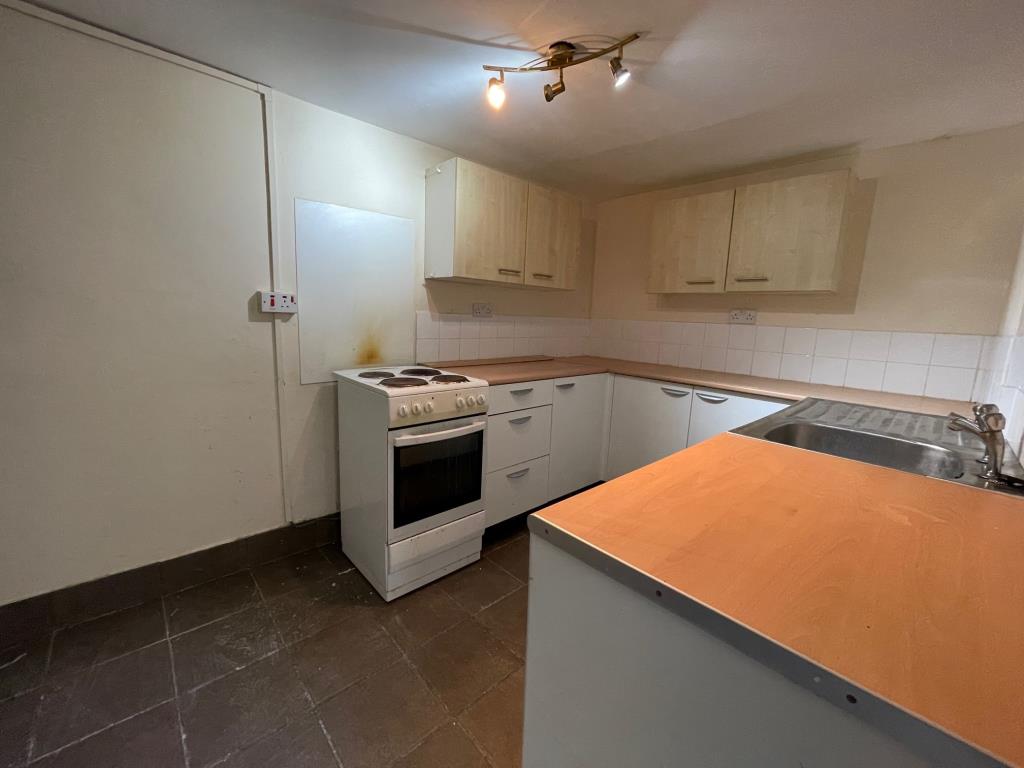 Lot: 86 - TWO-BEDROOM TERRACE HOUSE FOR IMPROVEMENT - Kitchen at the rear of the property